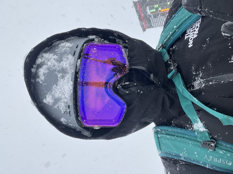 Snowboarding in purple goggles